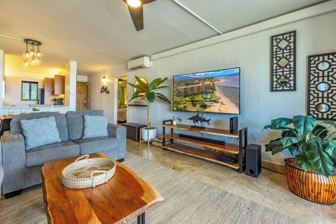 Relax in a cozy living room with Hawaiian charm and your favorite shows on the big screen.