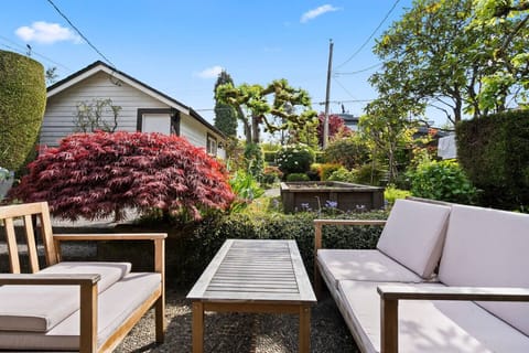 Garden Retreat: Unwind in a vibrant garden oasis with comfortable seating and lush views!