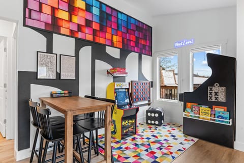 Game room packed with arcade games, board games, books, & more—fun for everyone!