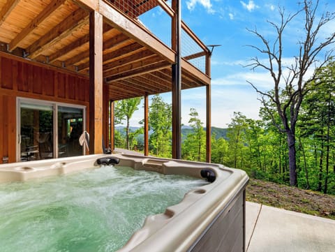 Soak in the mountain air from the private lower-level hot tub.