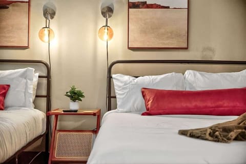 “Warm & restful” — Relax beneath glowing sconces in this stylish double setup, designed for both comfort and character