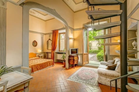 Suite, Garden View | Living area | TV