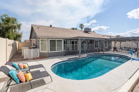 Large heated pool with loungers, perfect for soaking up the Arizona sunshine