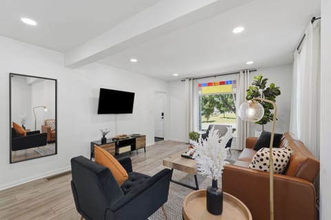 Bright modern living room with stylish seating and sunny picture window