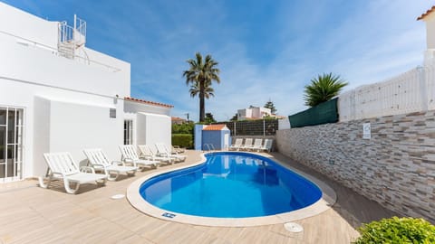 Private swimming pool with sun loungers in sunny Albufeira, perfect for relaxing Algarve holidays near Aveiros Beach.
#PrivatePool #Albufeira #AlgarveHoliday #AveirosBeach #VillaStay