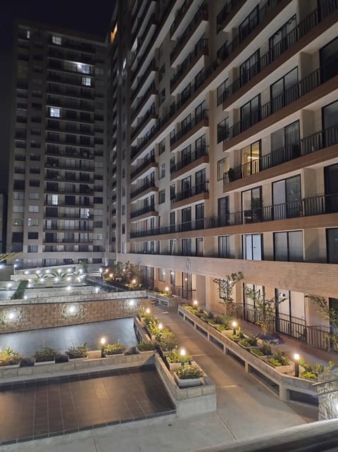 Modern residential building with nighttime lighting and a quiet atmosphere.