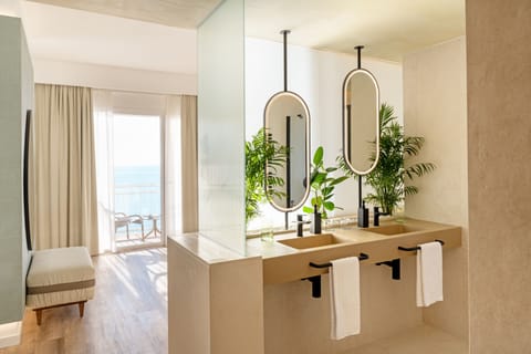 Junior Suite, Balcony, Sea View | Bathroom | Shower, free toiletries, hair dryer, slippers