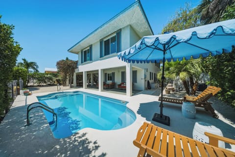 Stretch out on poolside loungers and enjoy a relaxing Florida Keys getaway in this Marathon FL vacation home.