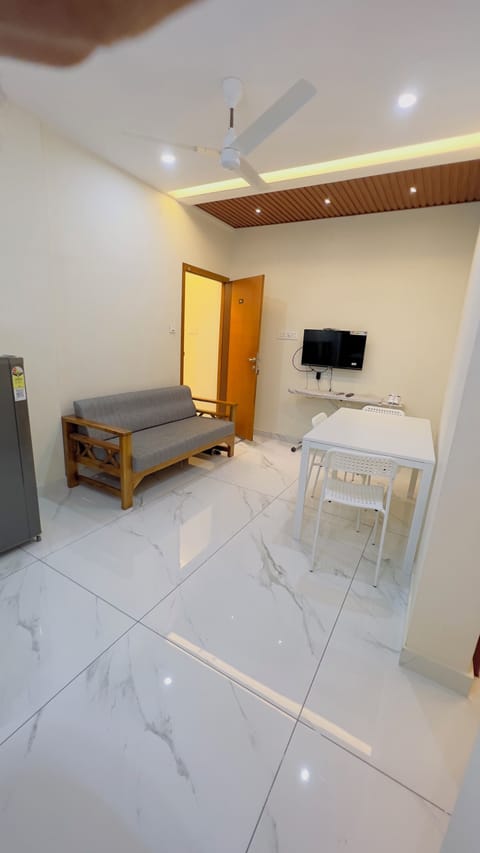 Deluxe Apartment | Living area | TV