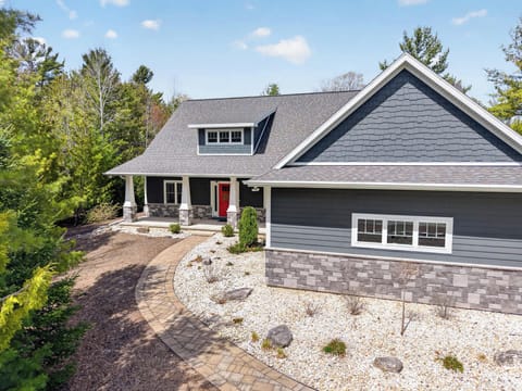 Welcome to Little Spring Getaway- Beautiful home in Fish Creek-sleeps 10 in 4 different bedrooms plus a spacious game room/ bunk room!