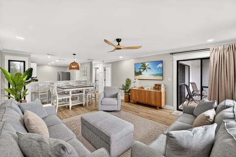 nviting living and dining space with coastal décor and easy access to the private balcony.