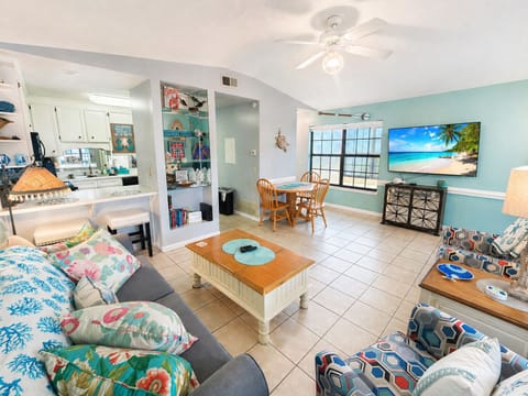 Open concept living area with vaulted ceilings