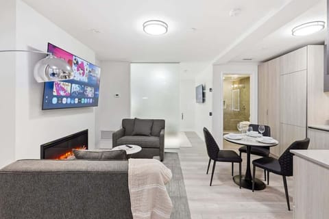 Cozy seating area with Smart TV and fireplace.