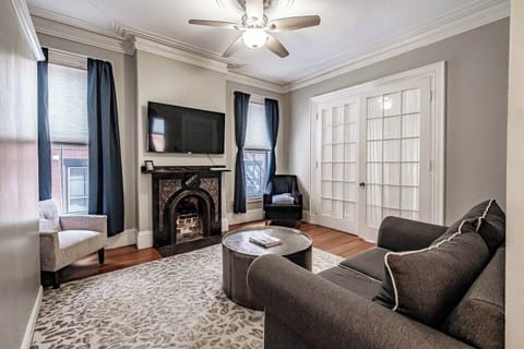 Unwind in the inviting living room, where a cozy fireplace and comfortable seating create the perfect spot to relax after a day of exploring.