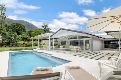 Watch the afternoon light shimmer across the pool from the outdoor lounge, where fresh breezes and lush garden surrounds make it easy to lose track of time.