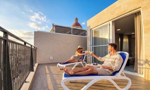 Rooftop balcony terrace with city views and sun loungers