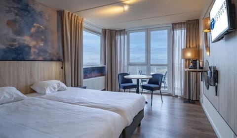 Wake up to soothing views from twin beds by the window.