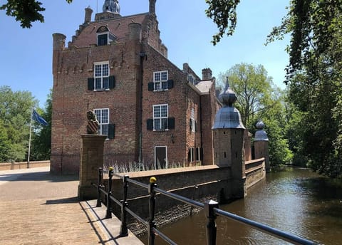 Wander beside the moat and savor serene castle grandeur.