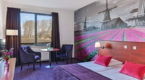 Wake up inspired by vibrant mural views and plush bedding.