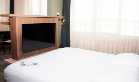 Stretch out comfortably with in-room entertainment and soft daylight.
