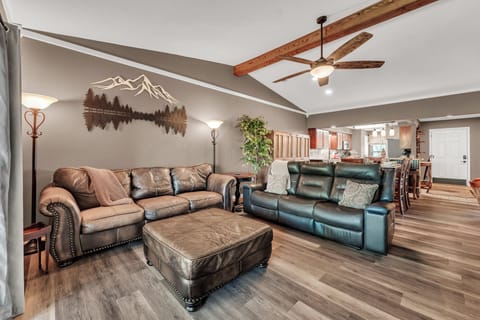 Comfortable living room with leather and a reclining sofa. 