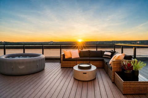 Private penthouse rooftop with sunset views and space to relax or gather.