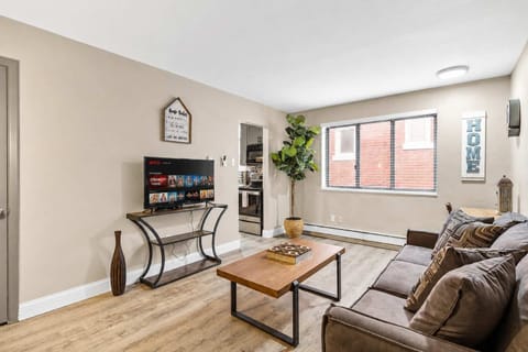 Living room — comfortable couch, smart TV, natural light