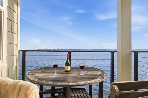 Waterfront deck seating for coffee with views of the water.
