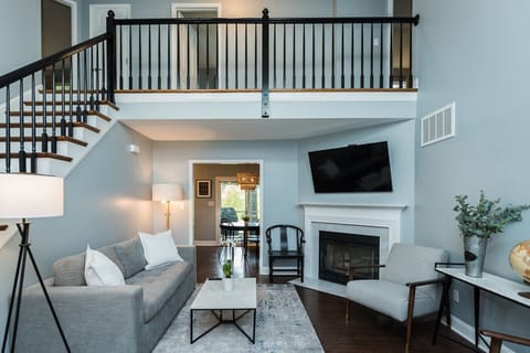 Bright living room with fireplace and vaulted ceilings