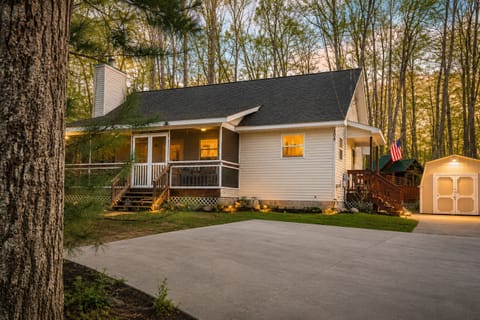Screened in front porch. Entrance into the house has 4 steps and a handrail.