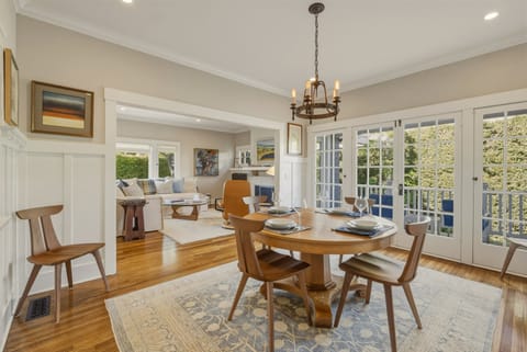 A sunny dining area with patio just outside