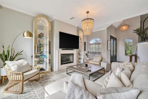 Open living room with fireplace and sleeper sofa