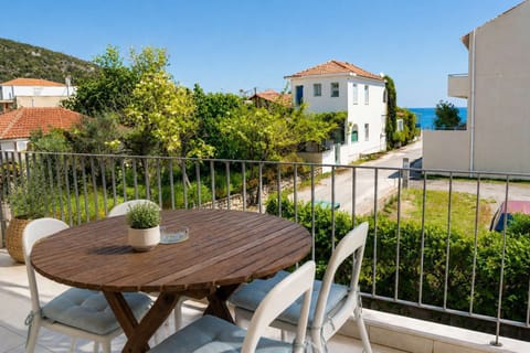 Enjoy your morning coffee or evening drink on the private balcony with outdoor seating and peaceful sea views, offering a relaxing spot to unwind during your stay near the sea