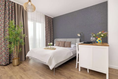 The living area's contemporary decor creates a chic and cozy environment.