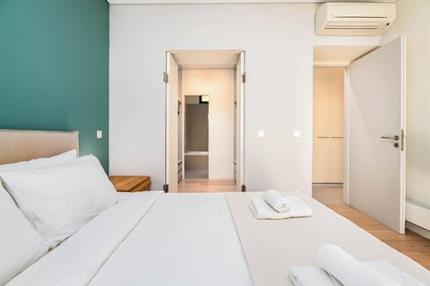 Deluxe Apartment, Garden View | Desk, laptop workspace, blackout drapes, iron/ironing board