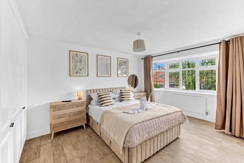 Bedroom 1 features a comfortable king-size bed with fresh linen and towels provided.