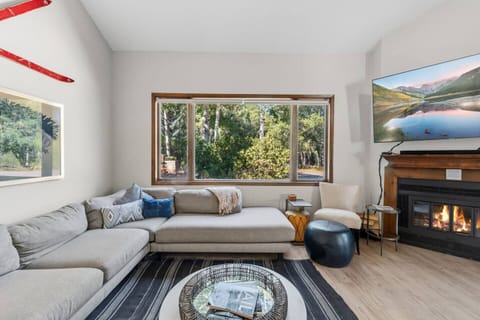 Spacious great room with fireplace and Smart TV