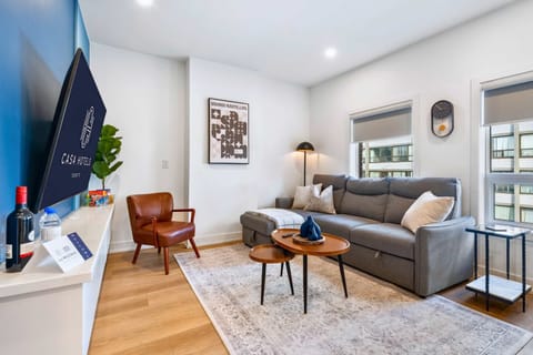 Bright living room with modern décor and comfortable seating.