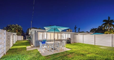 Enjoy evening meals under the umbrella in your fenced yard.