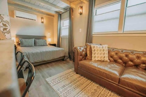 A full-size Italian leather sofa and queen-sized bed await your comfy stay!