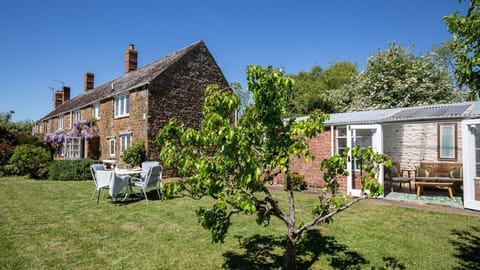 A large cottage garden with summer house