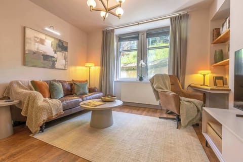 ✨ Unwind in this cozy, light-filled living space—perfect for relaxing after a day of exploring.
