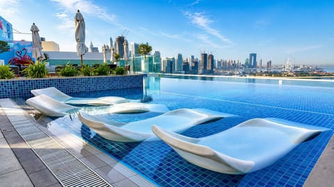 2 outdoor pools, open 10:00 AM to 9:00 PM, pool umbrellas, sun loungers