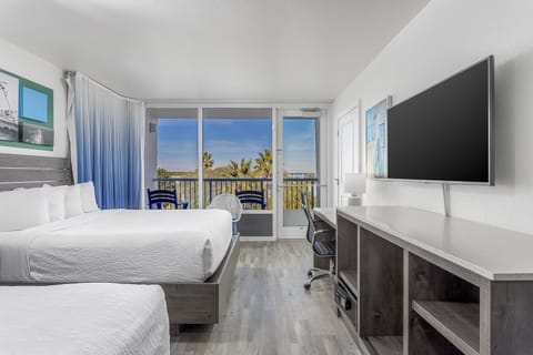 Stretch out in airy comfort with balcony light streaming in.