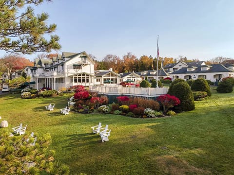 Linger on lush green lawns surrounded by vibrant blooms and the gentle rhythm of slow afternoons.