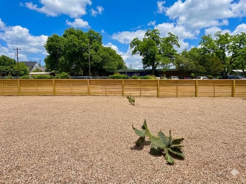 huge fenced yard with sitting area, swing. trees