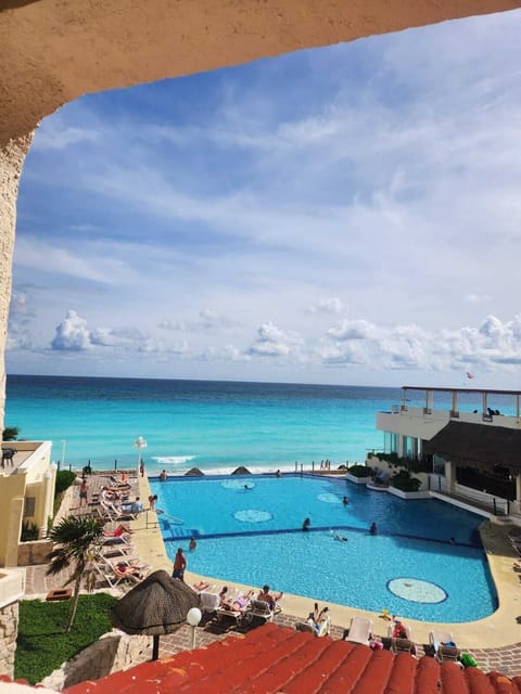 Studio, 2 Queen Beds, Beach View | Pool | Outdoor pool, open 7:00 AM to 9:00 PM, pool umbrellas, sun loungers