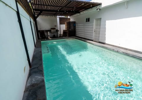Private pool located in the backyard of this 3-bedroom, 2-bath downtown home. Built in 2020, the pool area features expansive outdoor entertaining space with lounge areas and a barbecue grill .