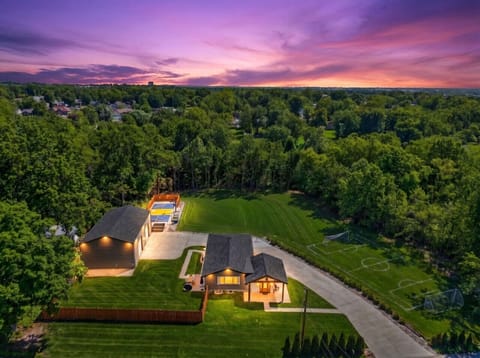 Welcome to The Stadium—a private 2.2-acre estate with every amenity you could imagine! Beautifully designed home, professionally lit basketball court, full-size soccer field, disc golf course, and manicured grounds framed by mature trees