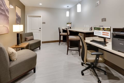 On-site business center equipped for work, printing, and office needs.